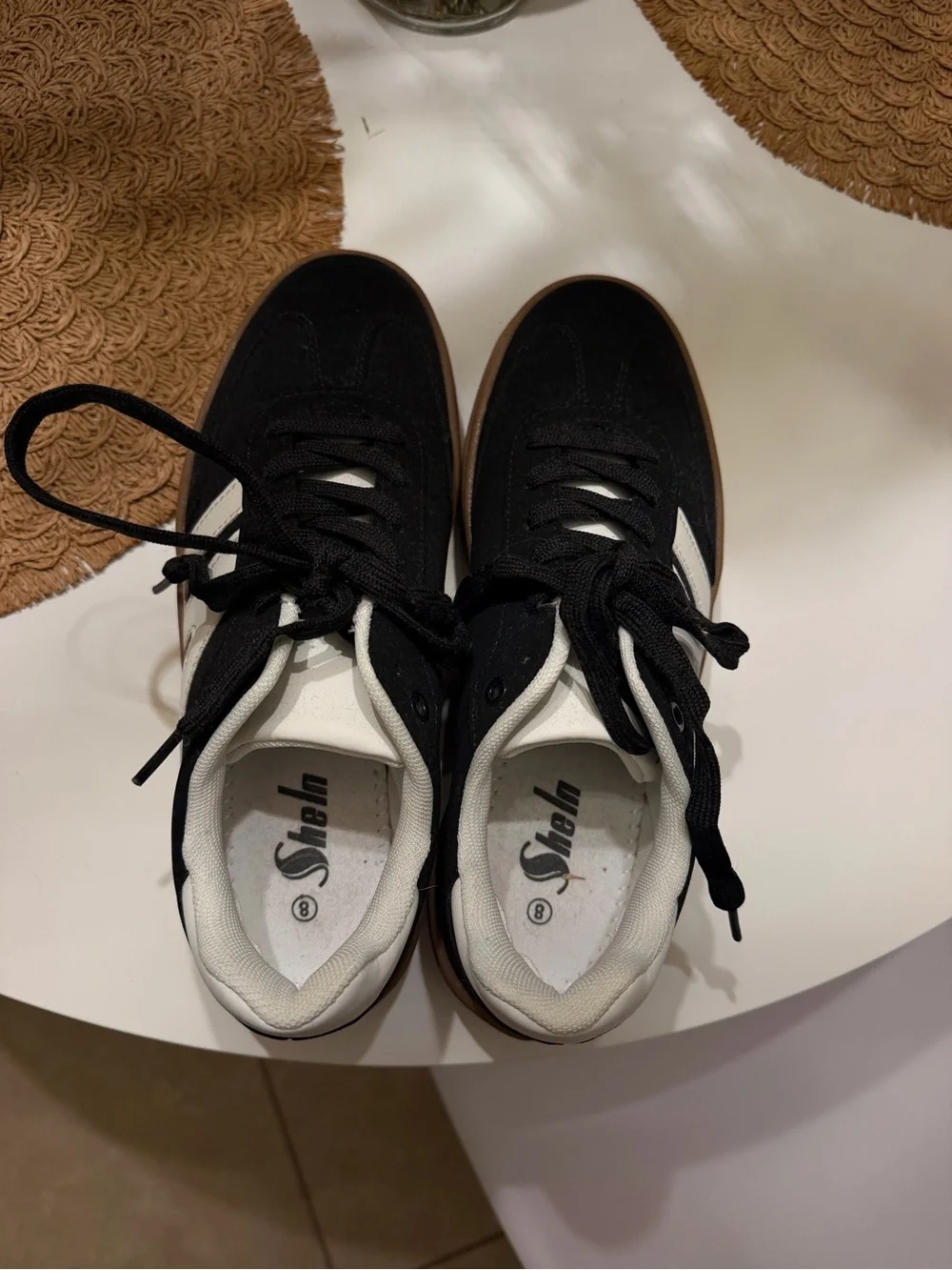Platform Lace-Up Sneakers in Black and White.